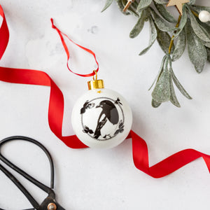 Powder Butterflys black and white magpie bauble with red ribbon and gold trim