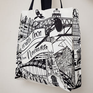 angled view of the newcastle landmarks themed tote bag by powder butterfly illustrated in black and white