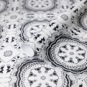 Close up of black and white patterned wrapping paper featuring newcastle landmarks