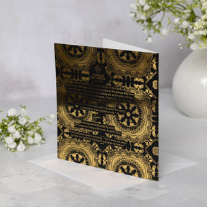 Bacl of the black soft-touch greeting card with Newcastle landmarks-themed gold mandala patterns on a white surface.