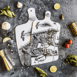 black and white illustrated chopping board featuring dunston staiths