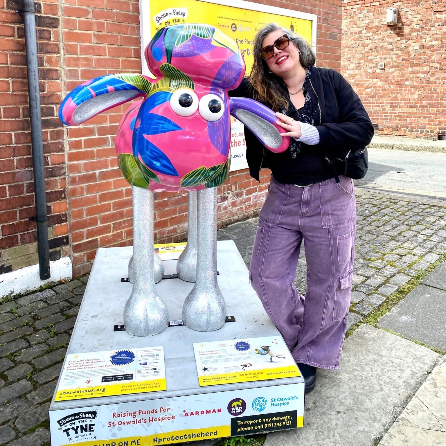 Image of Corinne Lewis-Ward with her Club Tropicana Shaun on the Tyne designf ro St Oswalds Hospice sculpture trail