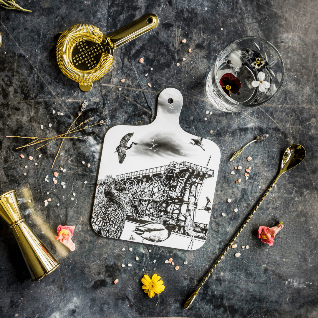 black and white illustrated chopping board featuring dunston staiths