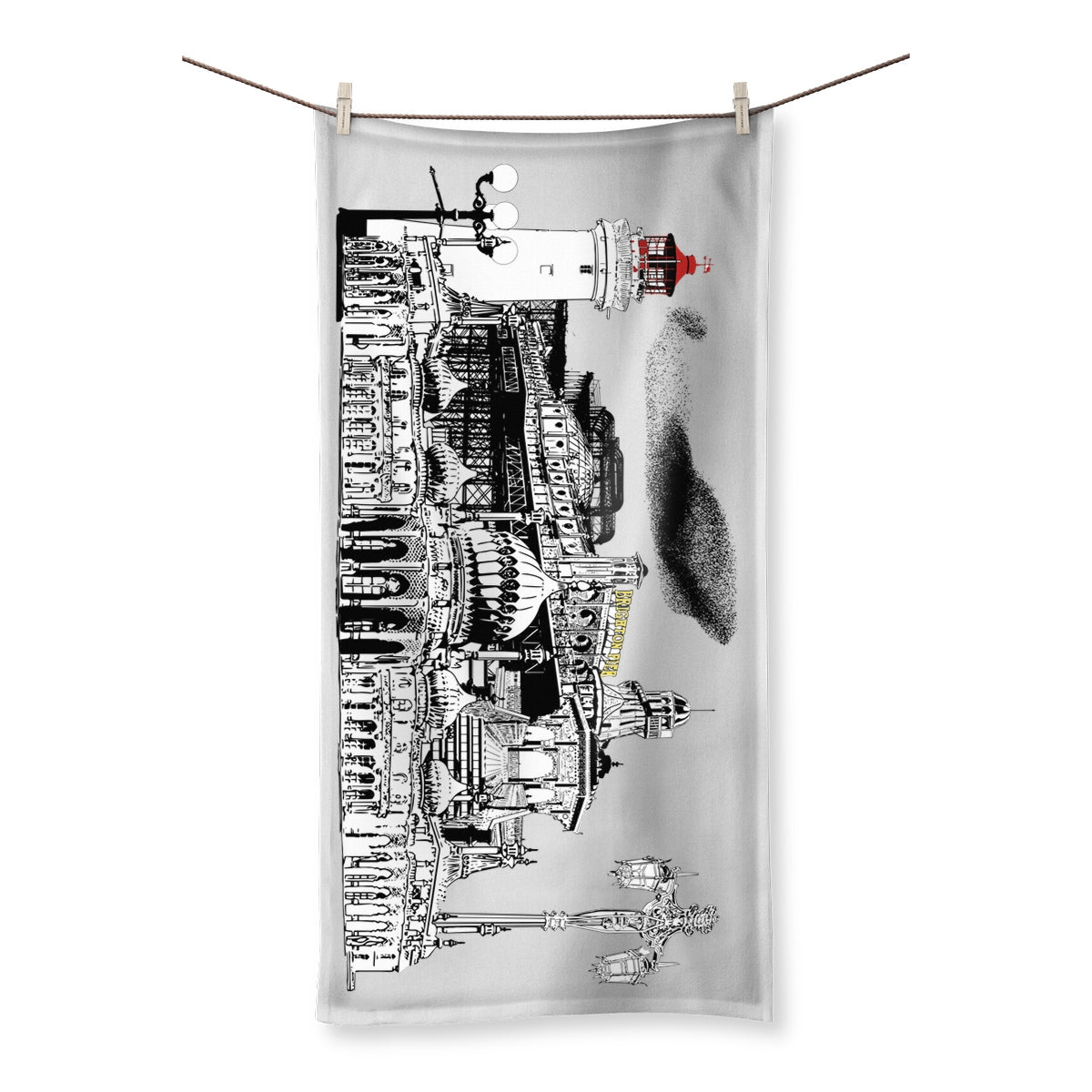 bath towel featuring a white and black illustration of Brighton pier and its various landmarks and features