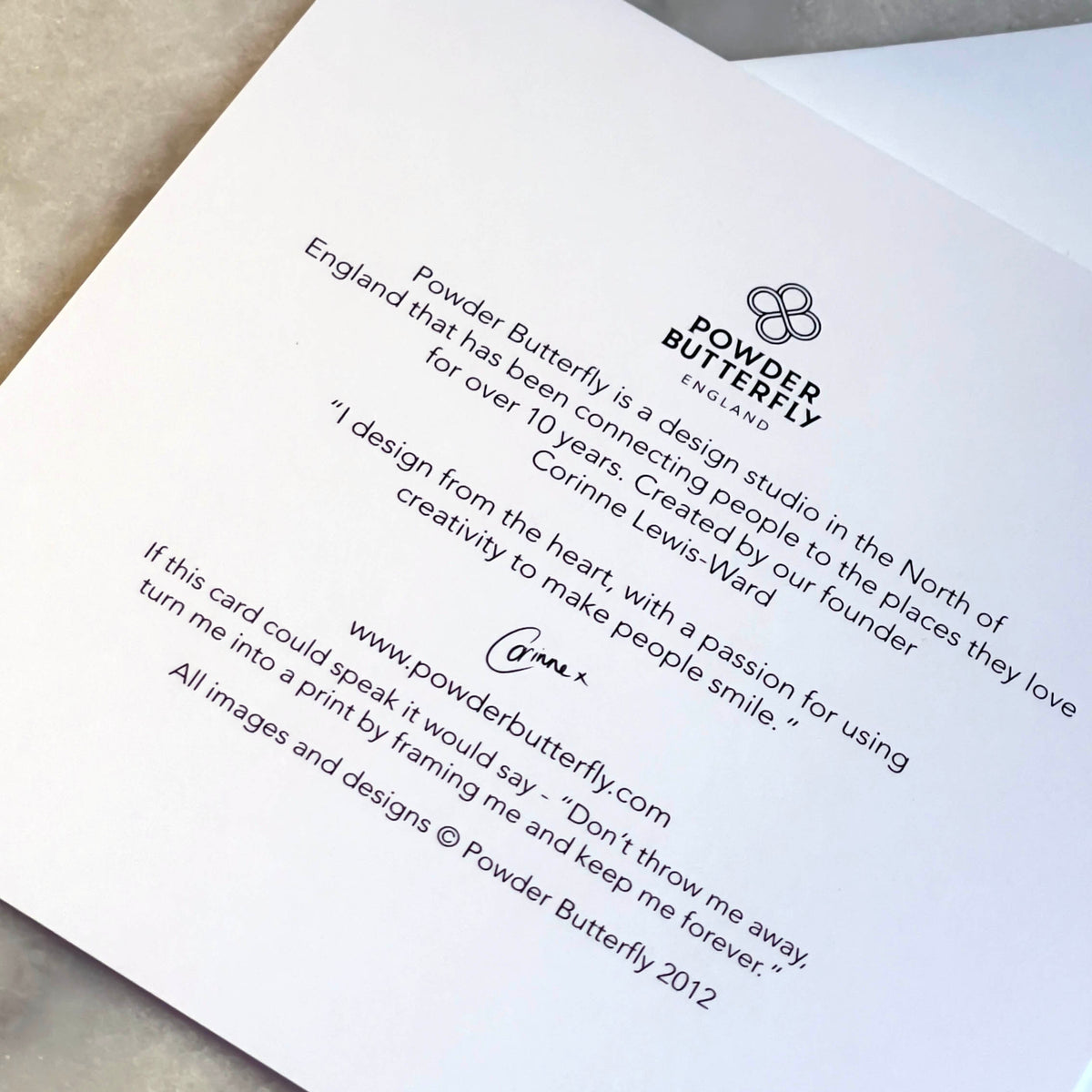 Card with Powder Butterfly branding and text on a light background