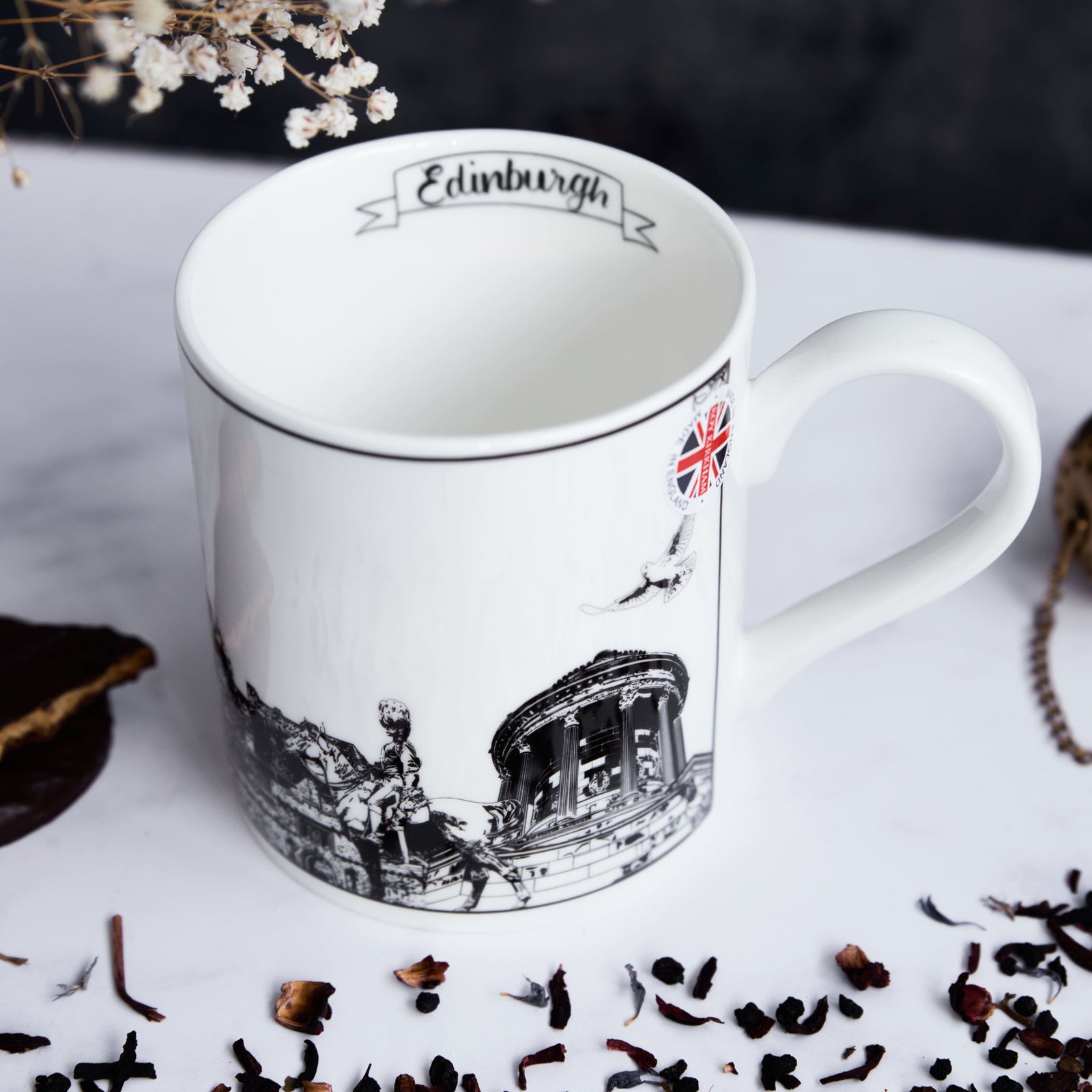 Closeup of the Edinburgh city mug showing the inside of the mug where there is a banner displaying the words "edinburgh".