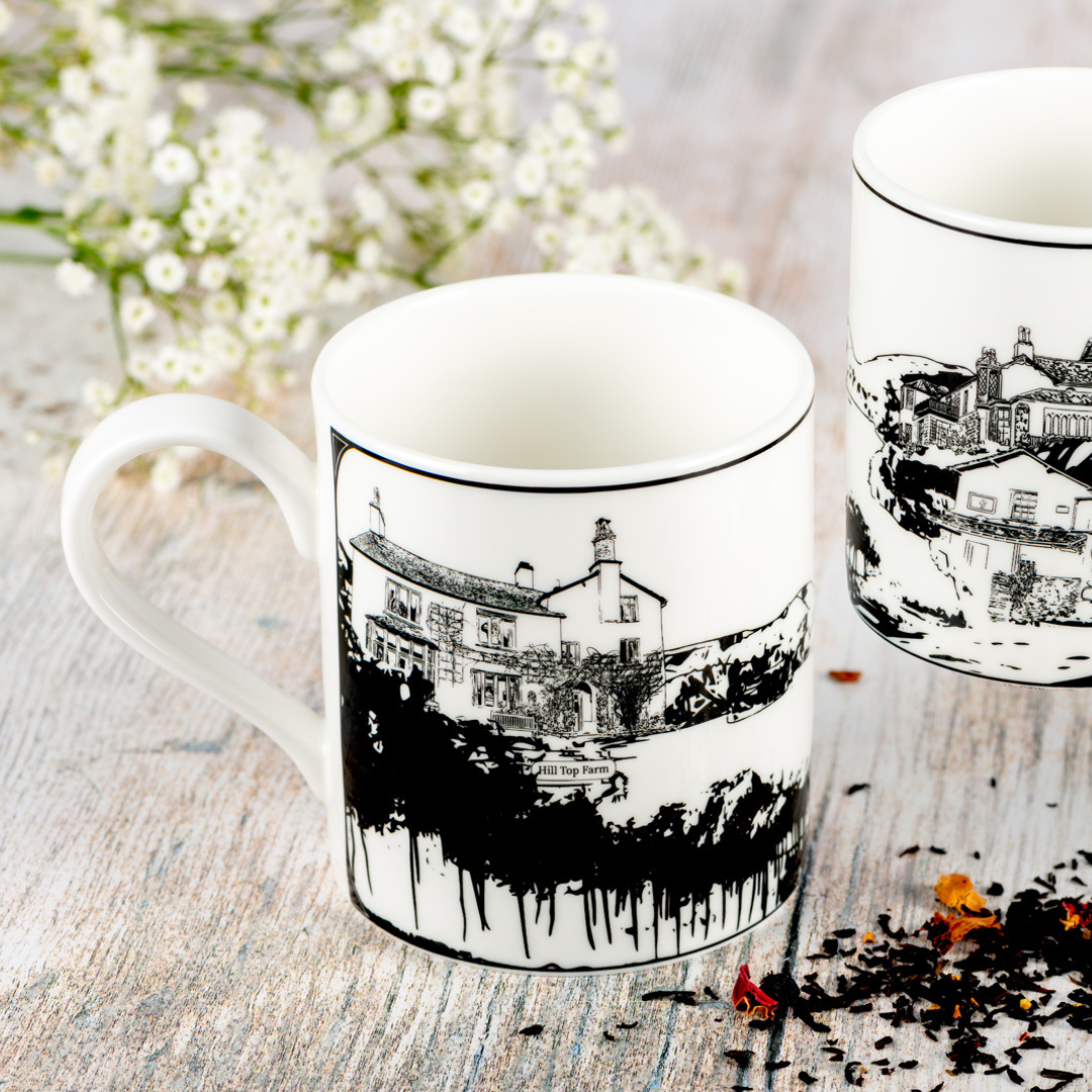 Image of Powder Butterfly Lake District China Mug featuring a back and white illustration of the hill top in the Lake District.