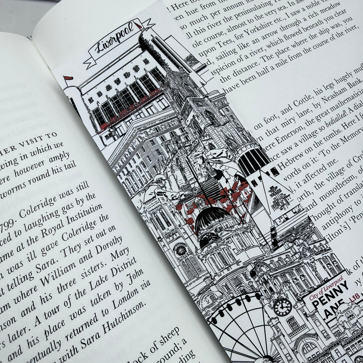 An open book or journal page featuring a detailed black-and-white architectural illustration of Liverpool Landmarks with red poppies and text.