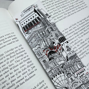 An open book or journal page featuring a detailed black-and-white architectural illustration of Liverpool Landmarks with red poppies and text.
