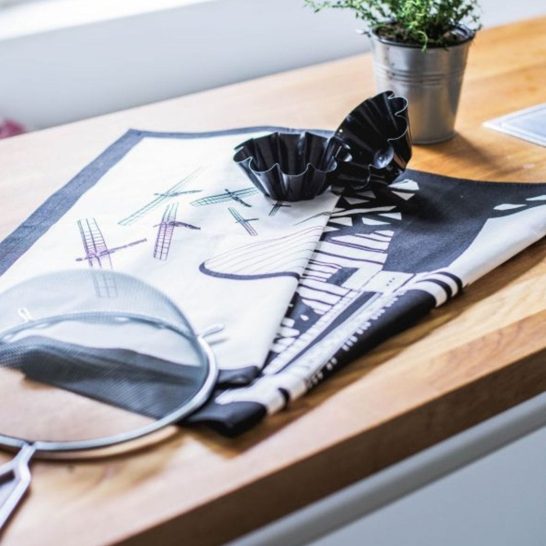 PowderButterfly 100% Organic Cotton Newcastle Tea Towel with black and white illustration of Newcastle and Gateshead monuments and landmarks