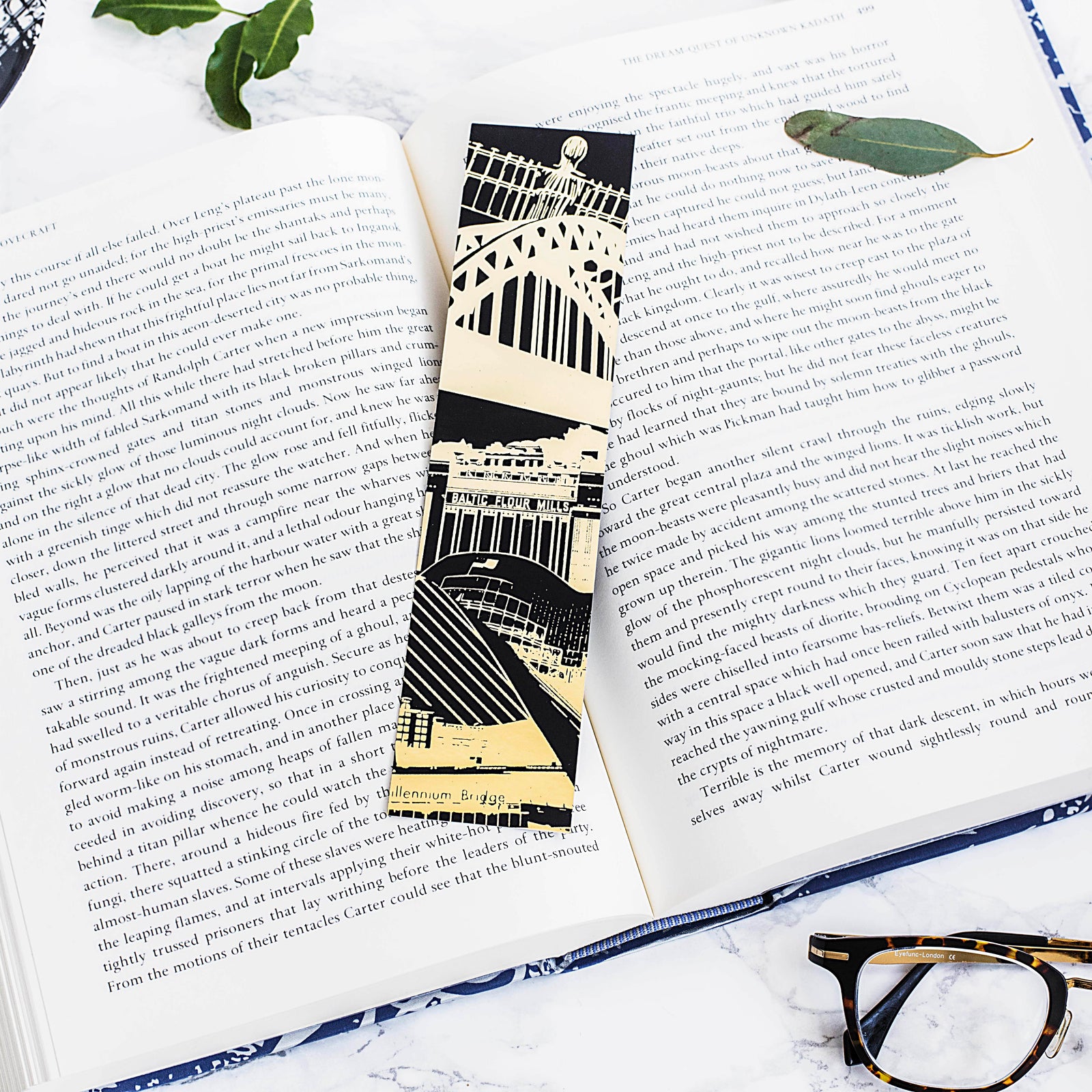 PowderButterfly Newcastle Gold Foil Bookmark with gold and black illustration featuring Newcastle and Gateshead's monuments and landmarks