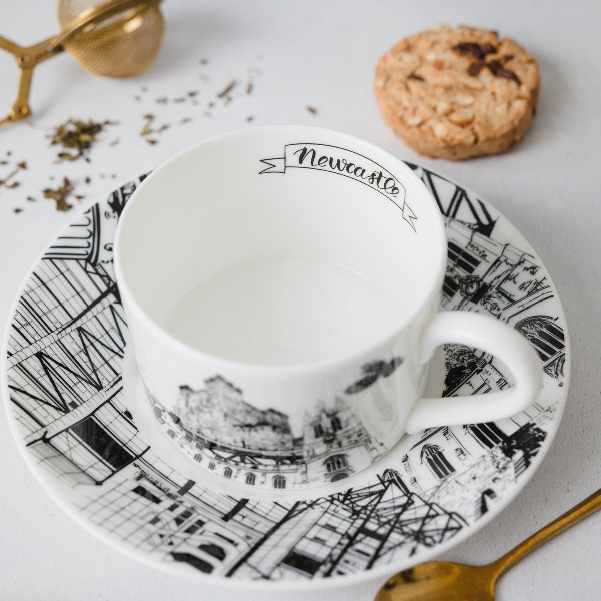 closeup image of the tea cup, image shows the cups inside design featuring the city name Newcastle.