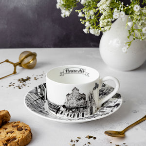 Newcastle themed teacup and sauced set, image contains various tea accessories.