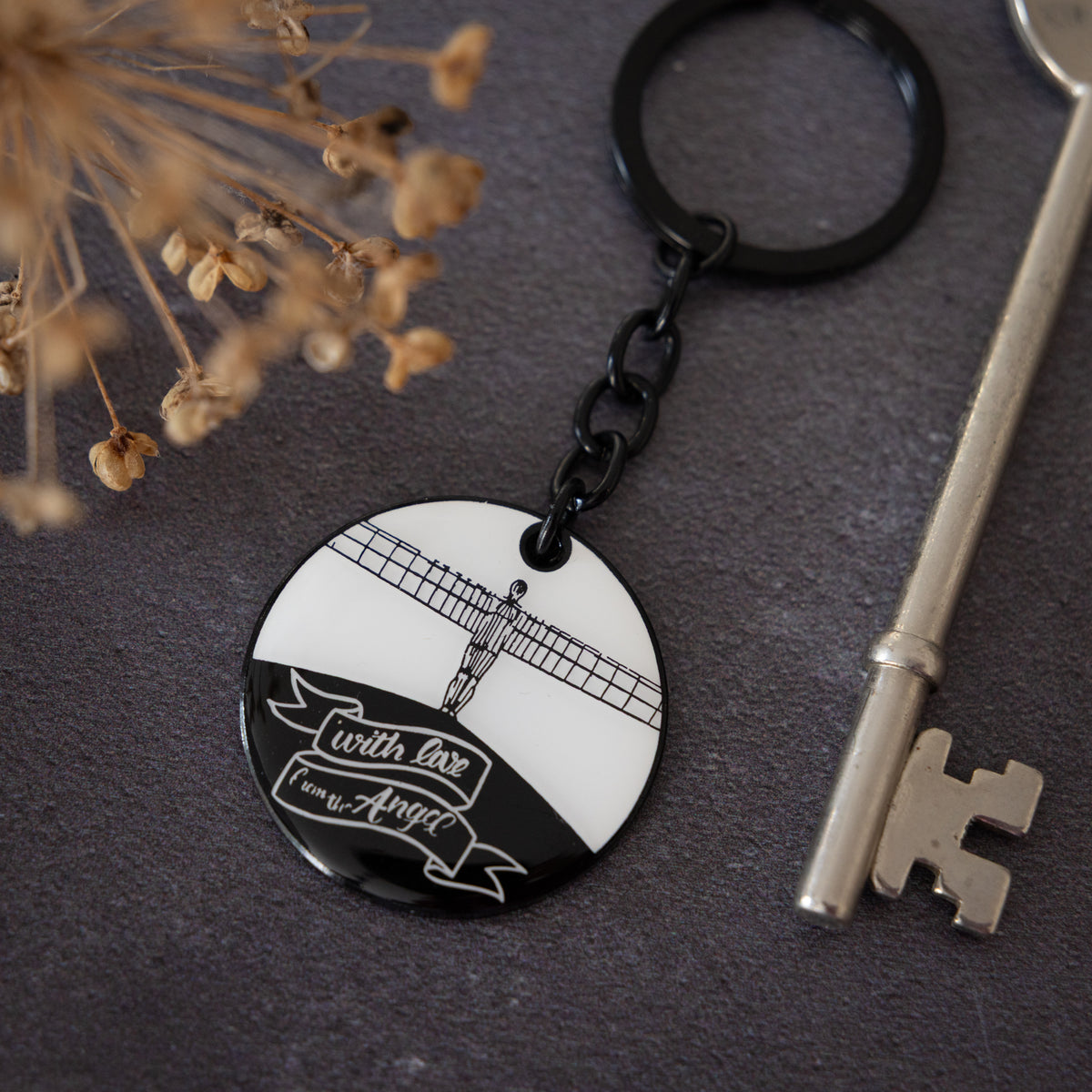Angel of the North Keyring by powder butterfly. Enamel keyring illustrated with black and white design