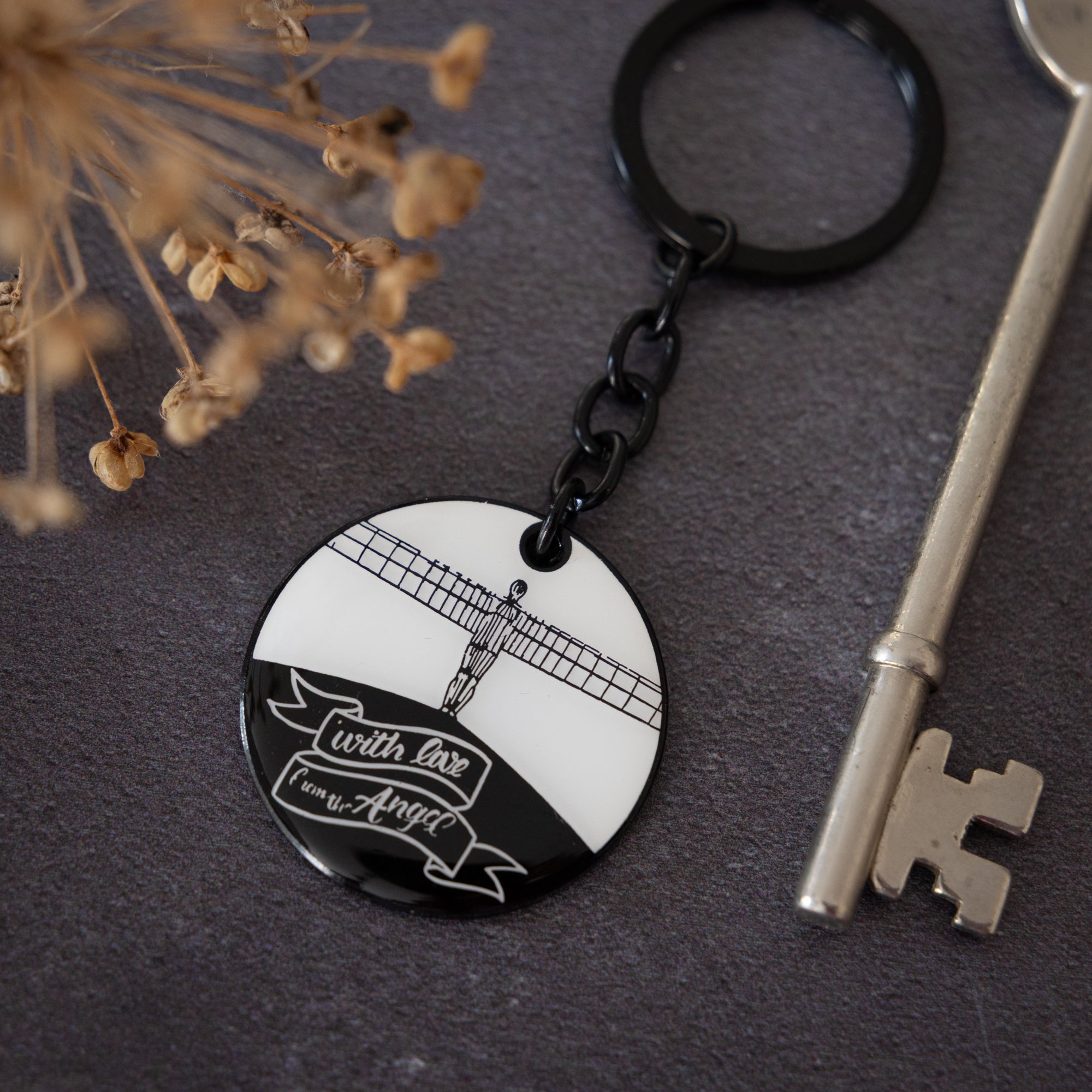 Angel of the North Keyring by powder butterfly. Enamel keyring illustrated with black and white design