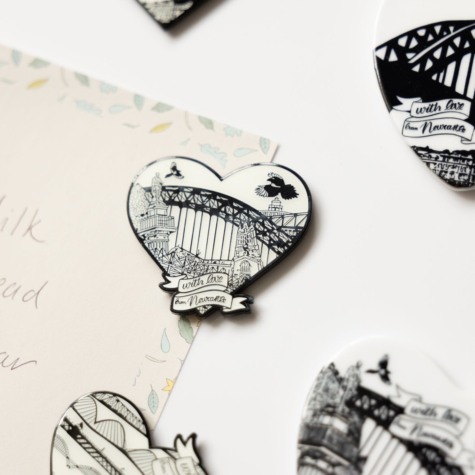 powder butterfly black and white enamel fridge magnets featuring famous newcastle landmarks and icons