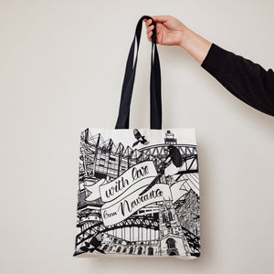 Someone holding up the newcastle landmarks tote bag by powder butterfly illustrated in black and white
