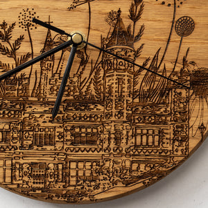 Closeup of the saltwell park woodburned clock by powder butterfly featuring icons and landmarks
