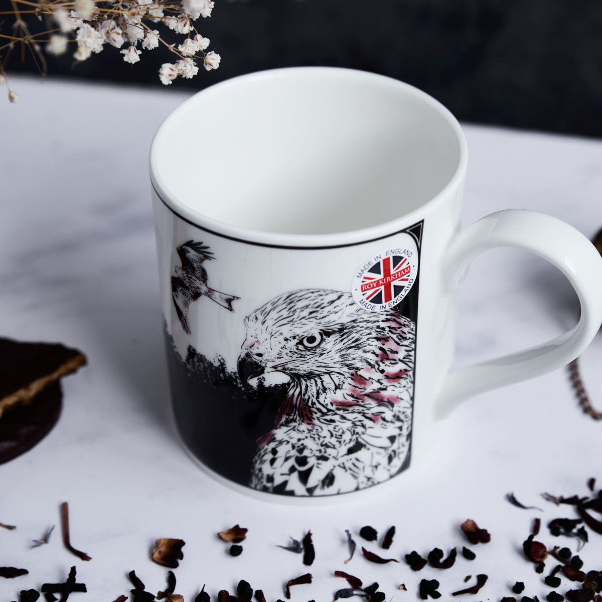 ceramic white mug featuring a black and white illustration of a red kite by powder butterfly