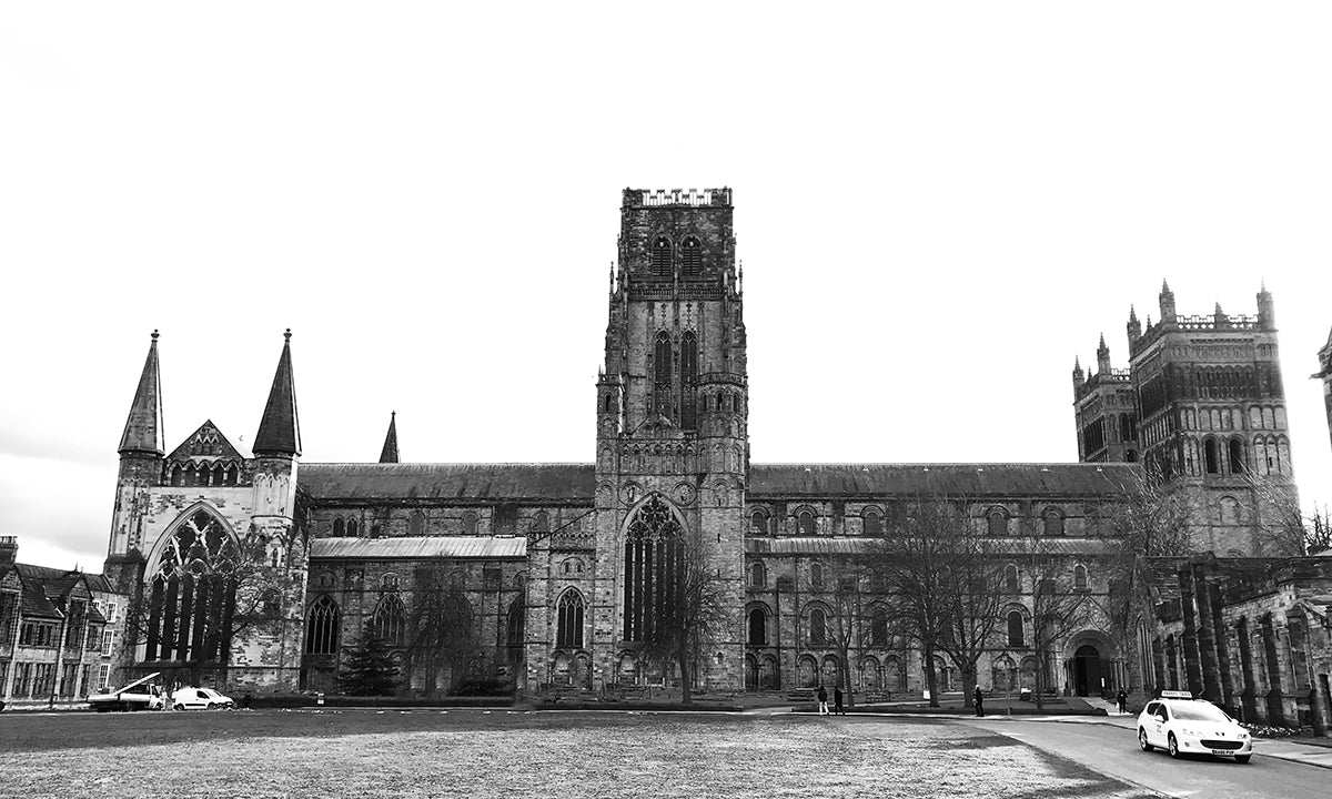 black and white image of Durham Cathedral populated with tourists.