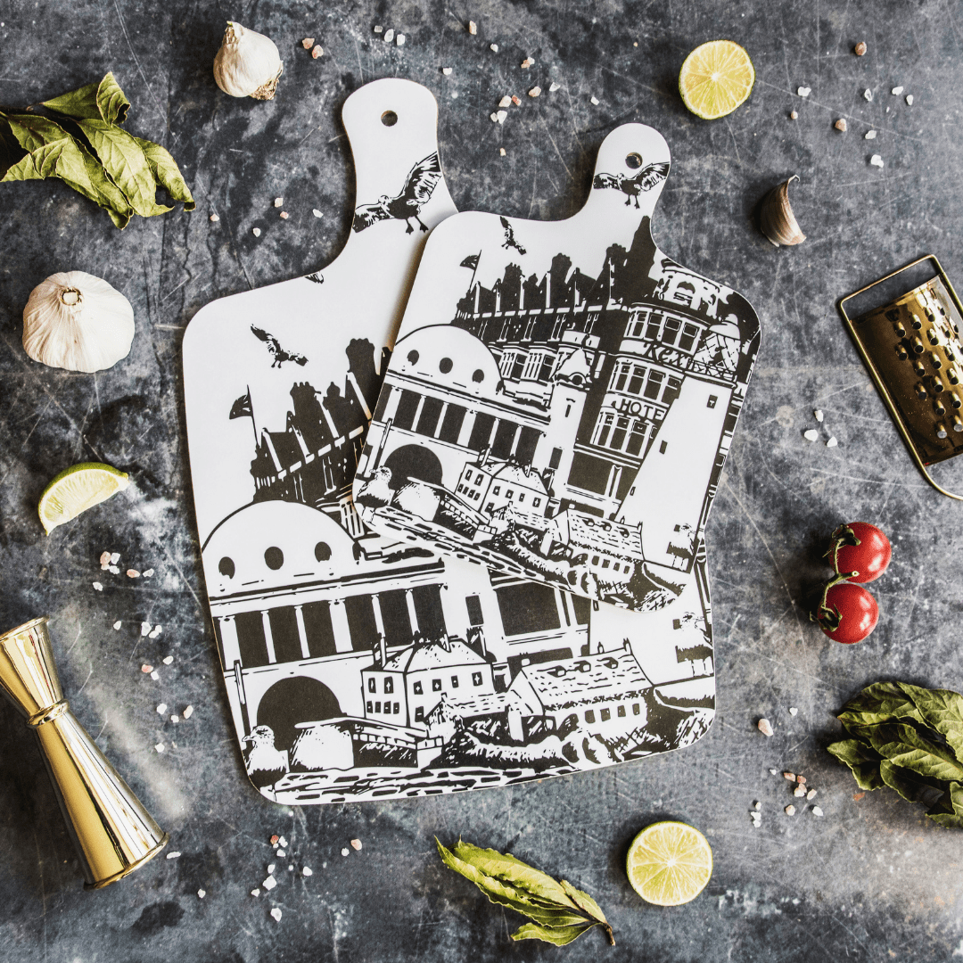 black and white illustrated chopping board with landmarks and monuments from whitley bay