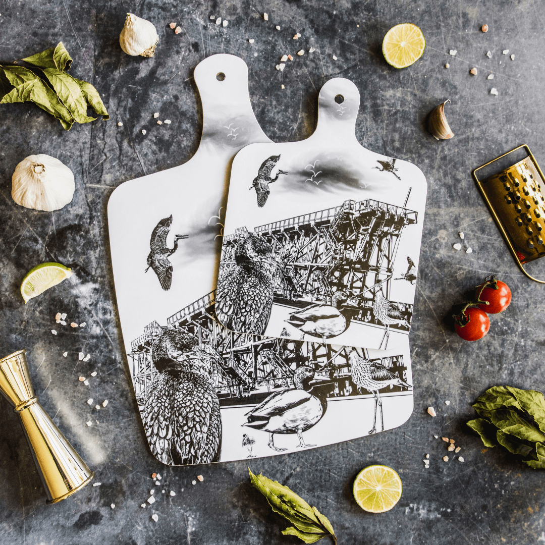 black and white illustrated chopping board featuring dunston staiths