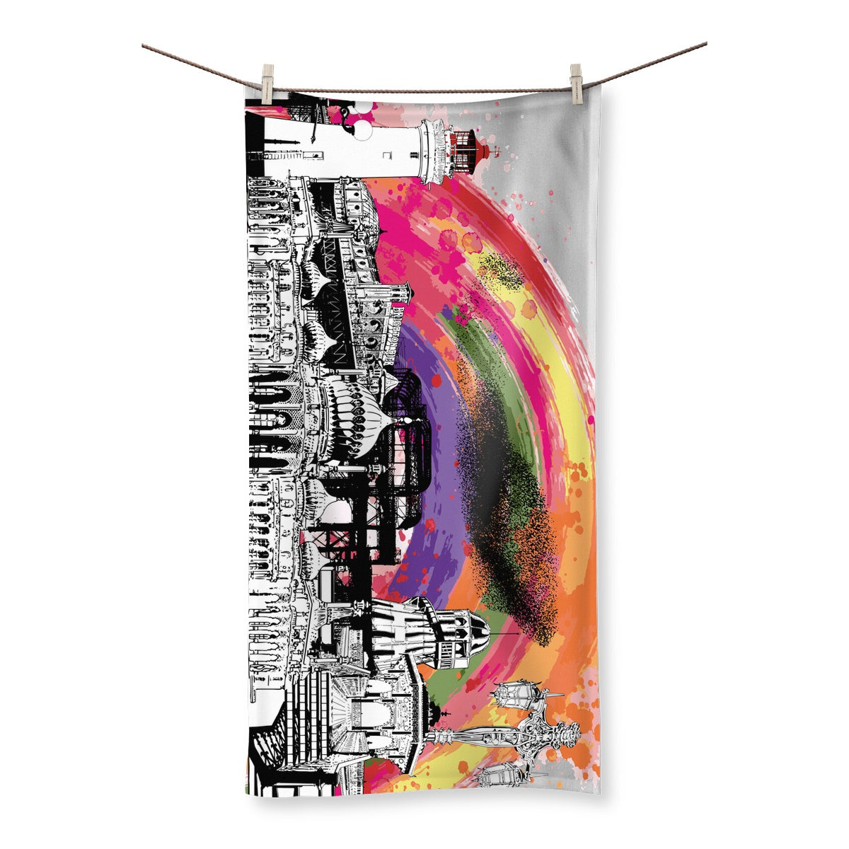 Towel Featuring a Print of Brighton landmarks with colourful rainbow behind the landmarks designed by Powder Butterfly