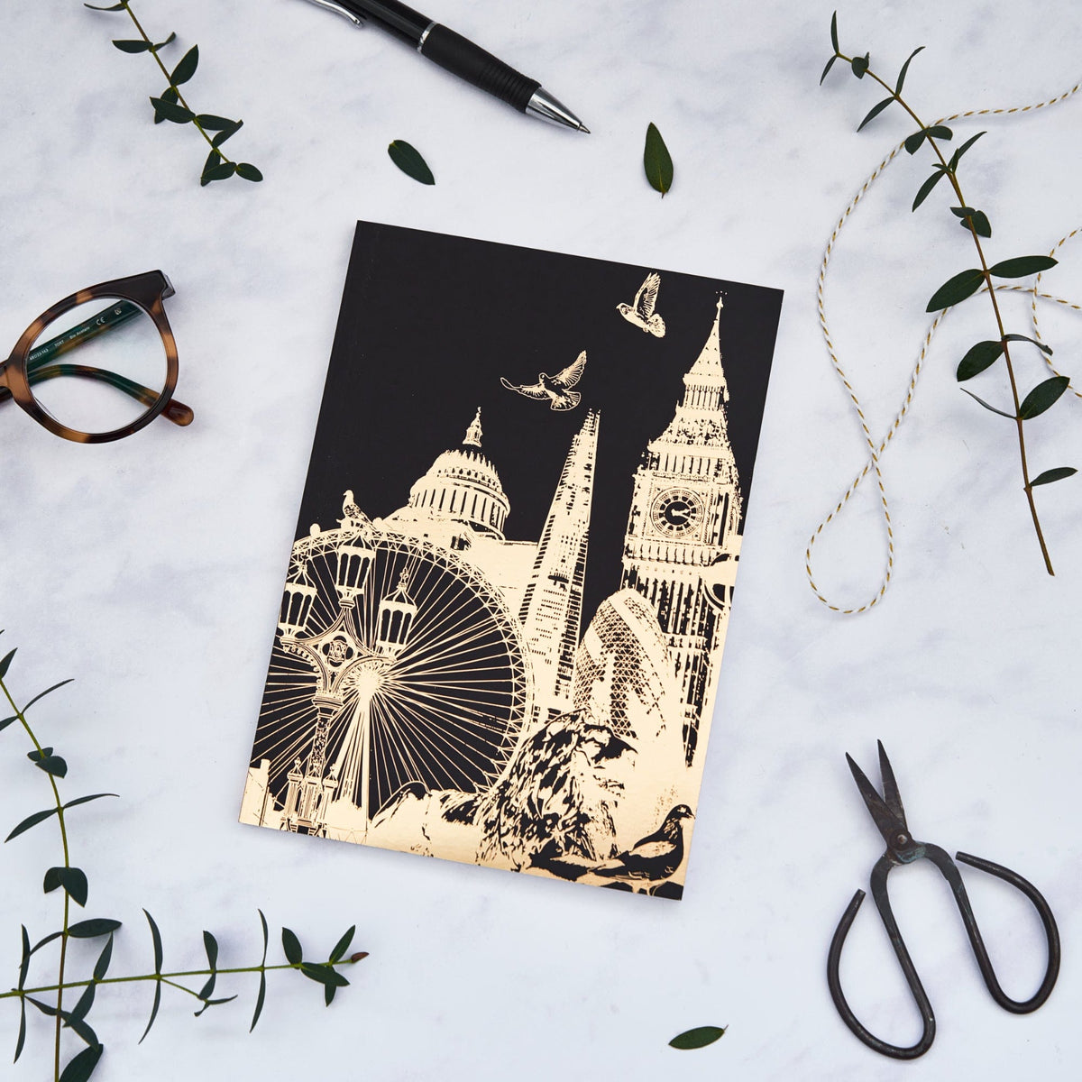 PowderButterfly Stationery London Softback Gold Foil Notebook featuring a golf foil illustration of Londons various Landmarks and Monuments