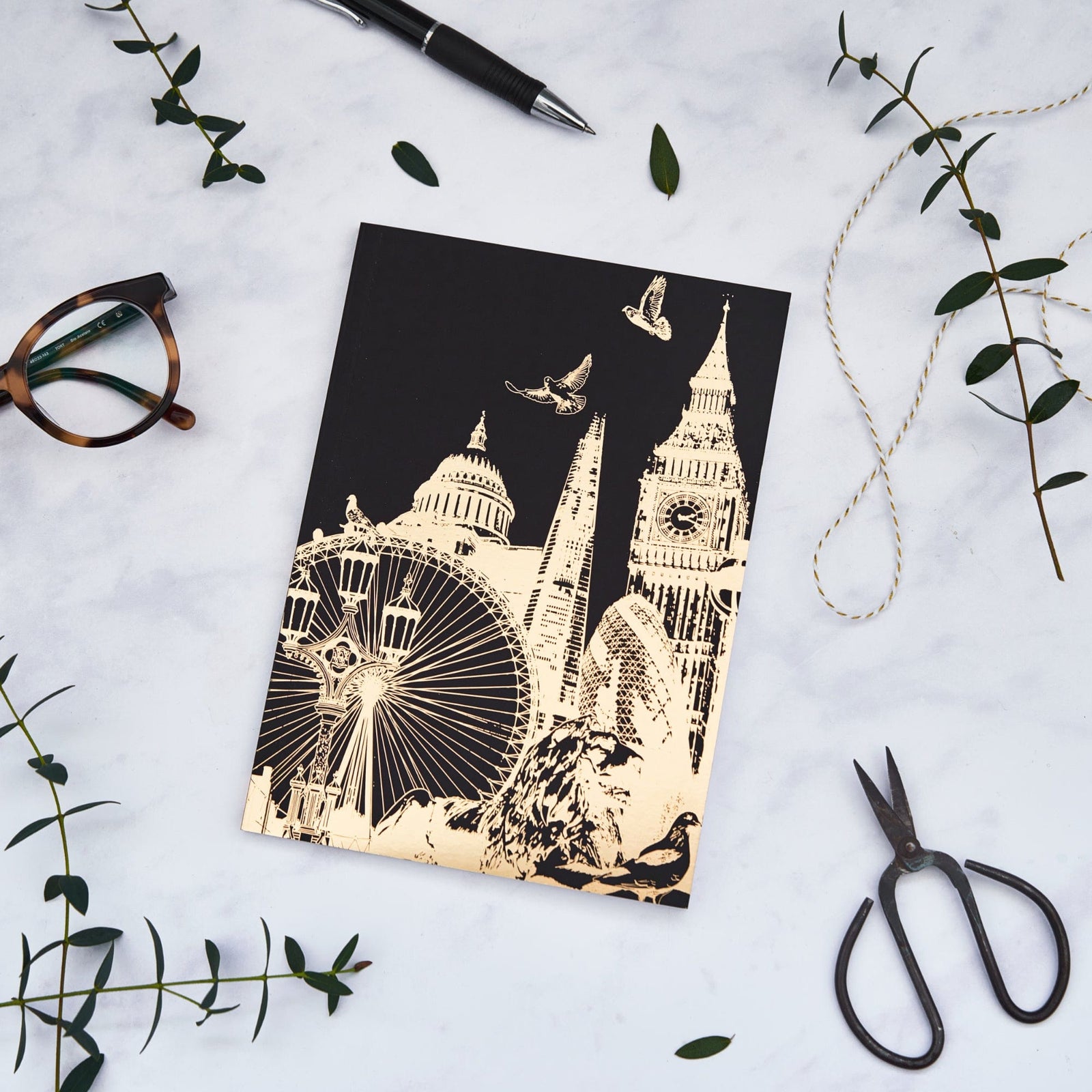 PowderButterfly Stationery London Softback Gold Foil Notebook featuring a golf foil illustration of Londons various Landmarks and Monuments