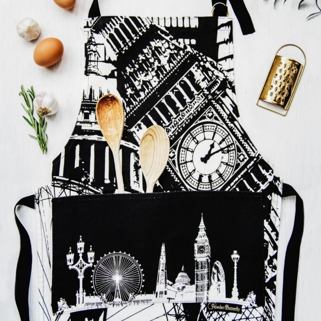 PowderButterfly London Apron illustrated in black and white featuring Londons most famous landmarks and monuments