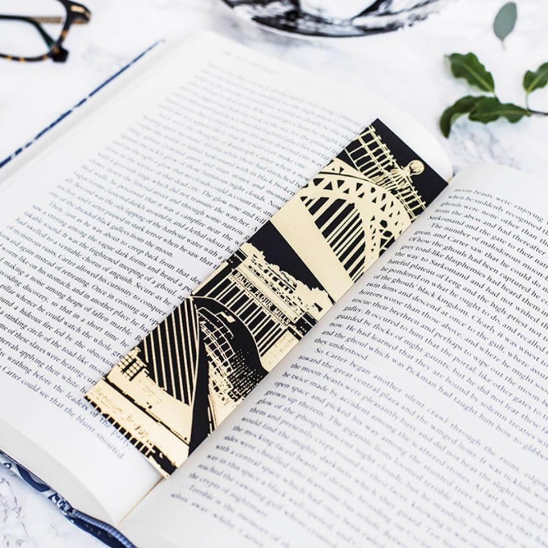 PowderButterfly Newcastle Gold Foil Bookmark with gold and black illustration featuring Newcastle and Gateshead's monuments and landmarks