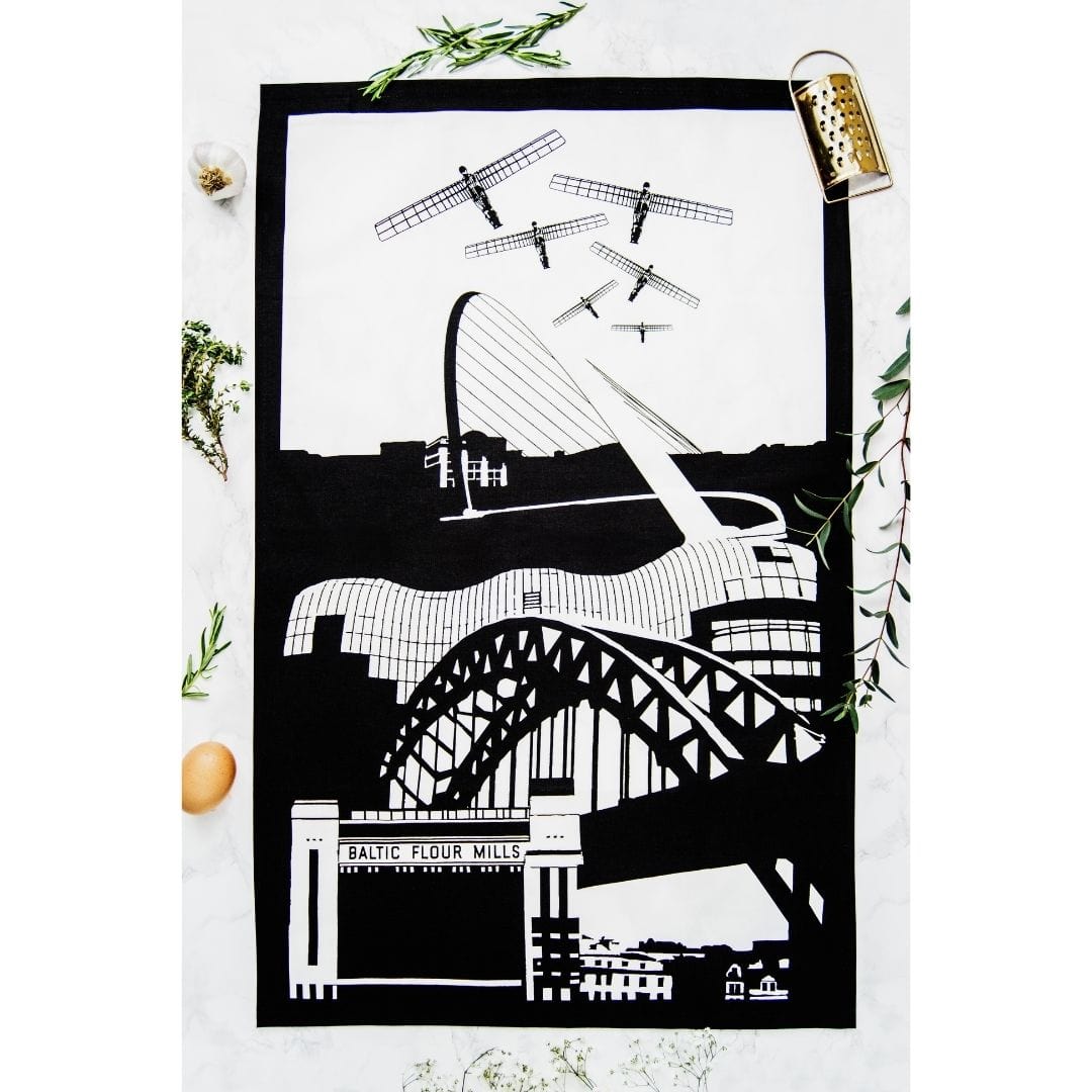 PowderButterfly 100% Organic Cotton Newcastle Tea Towel with black and white illustration of Newcastle and Gateshead monuments and landmarks