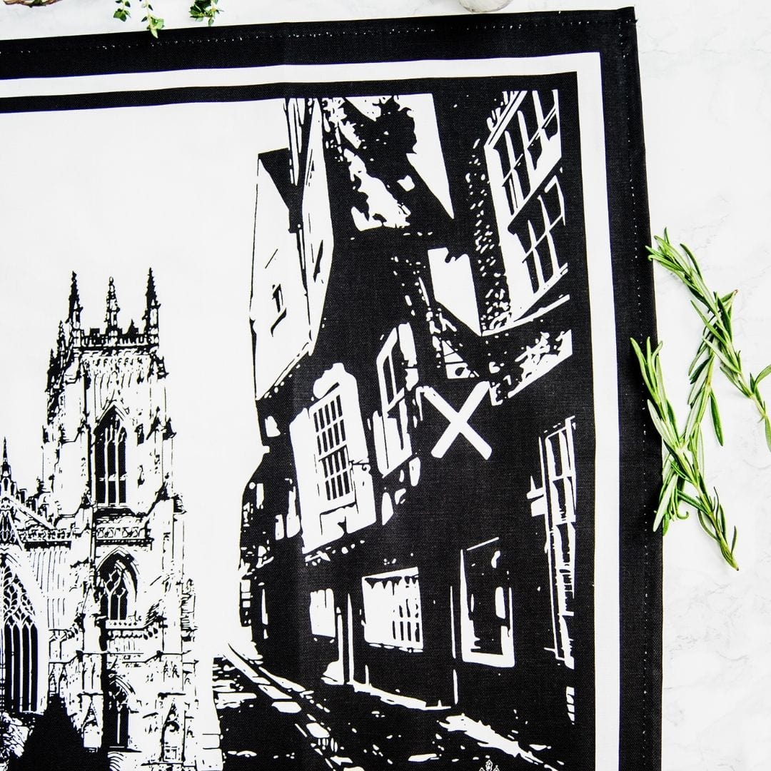 PowderButterfly York Tea Towel with black adn white illustration of Yorks monuments and landmarks