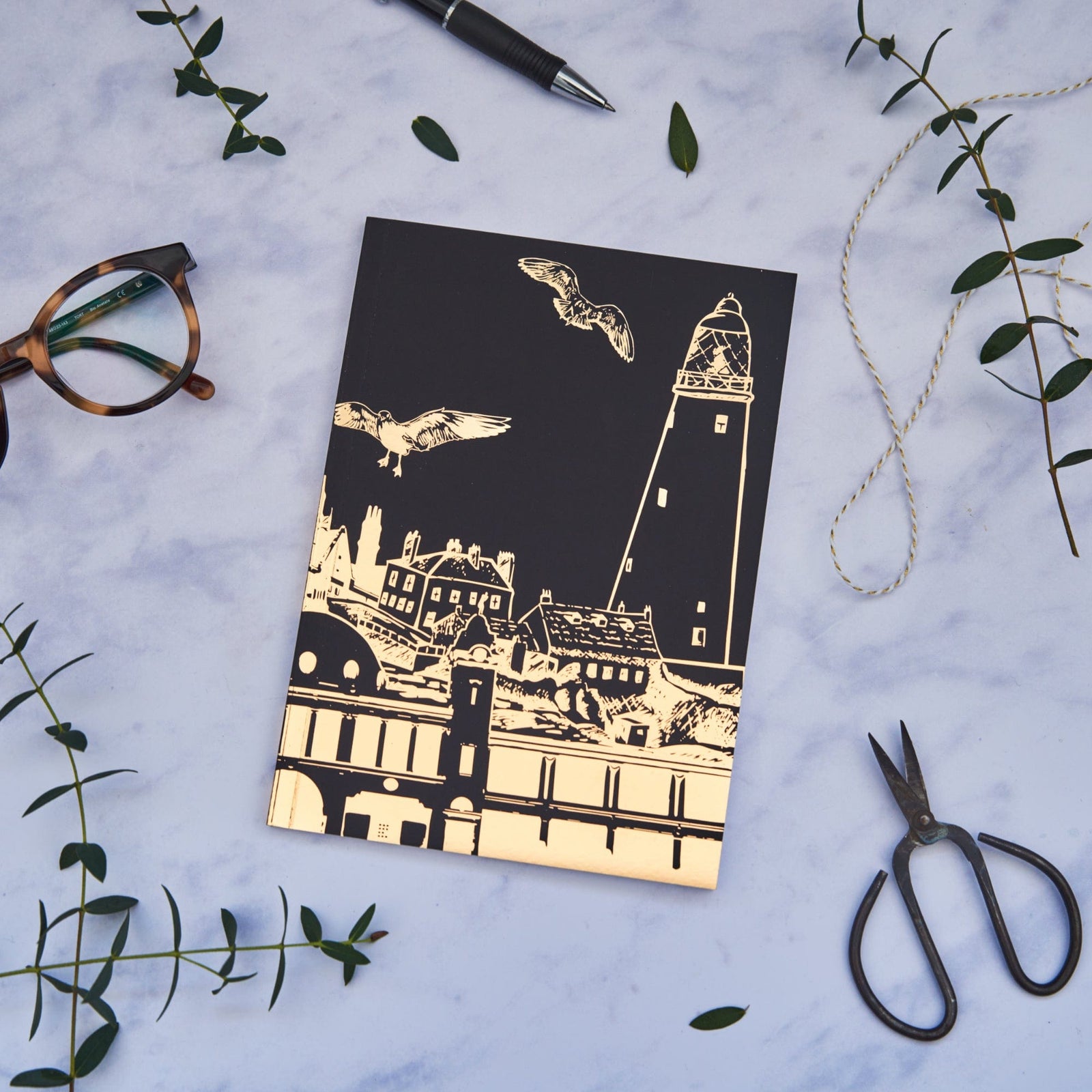 PowderButterfly Whitley Bay Softback Gold Foil Notebook featuring a golf foil illustration of whitley bays various landmarks and monuments