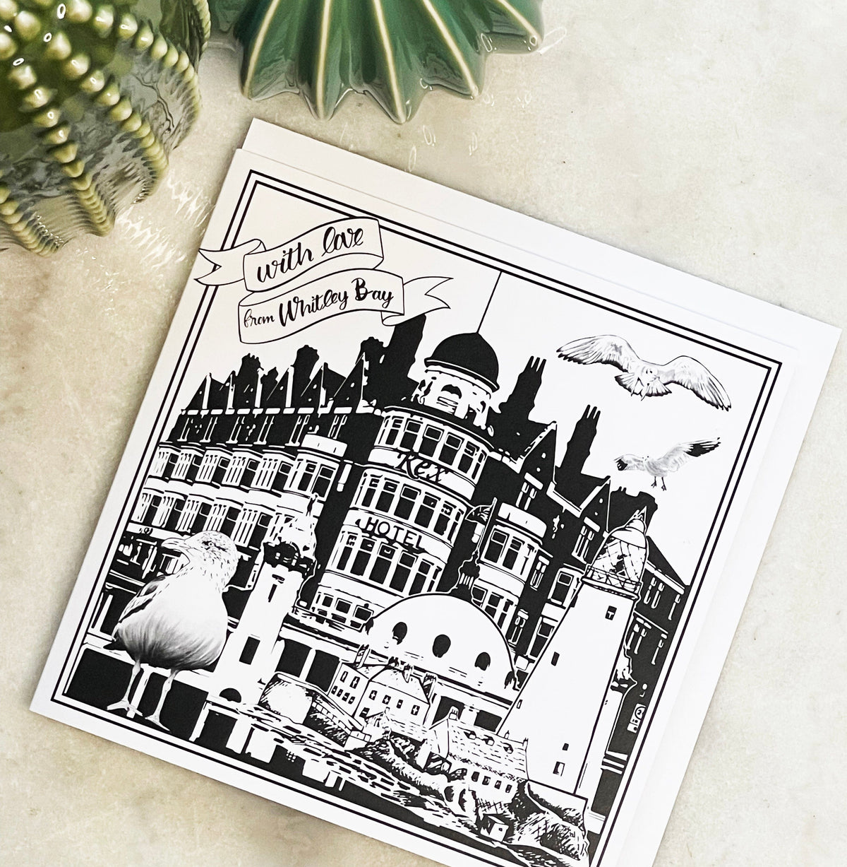 PowderButterfly With Love from Whitley Bay greetings card with black and white illustration of Whitley bays many landmarks and monuments